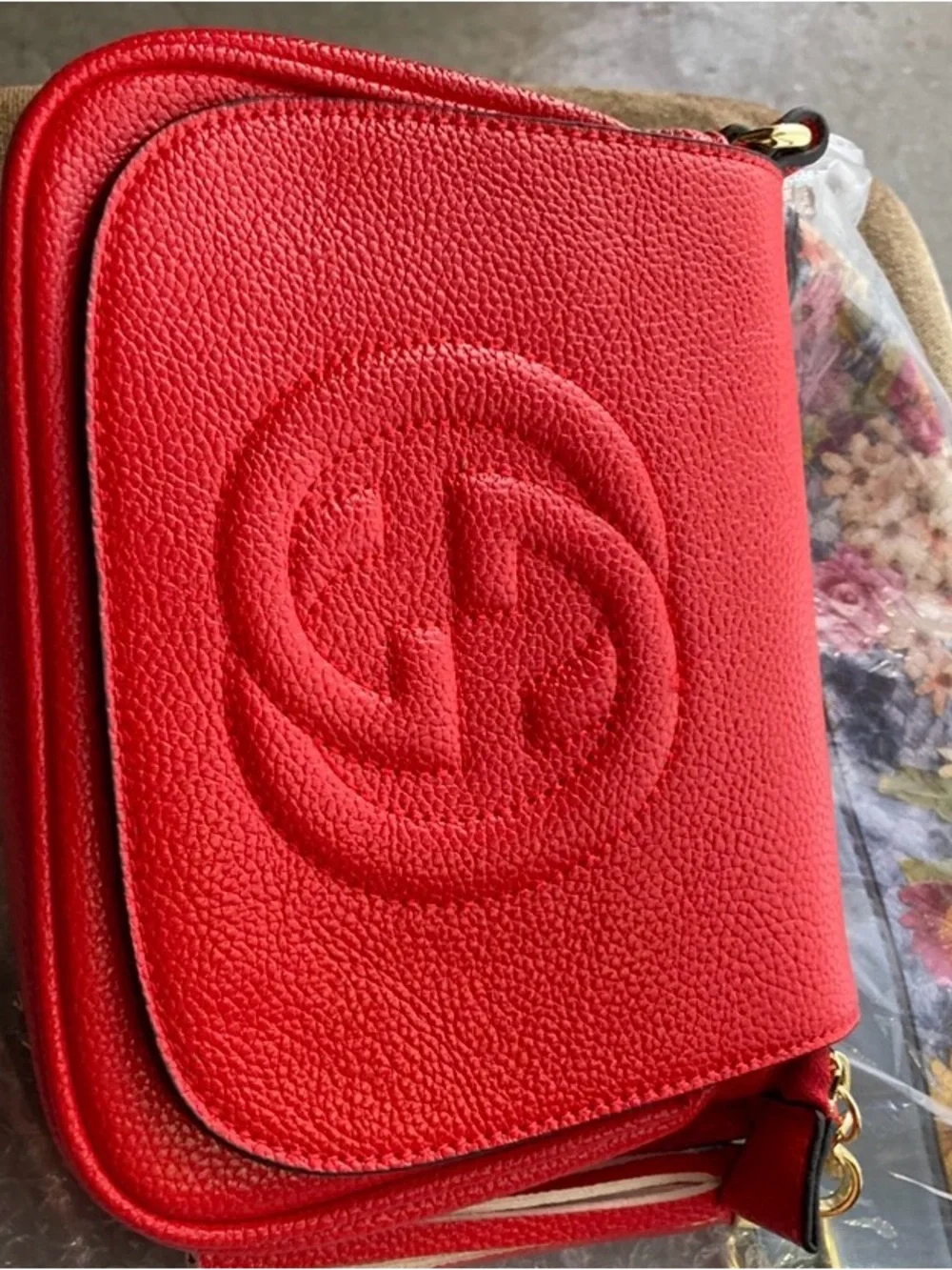 Compact Red Crossbody Bag with Tassel Accent